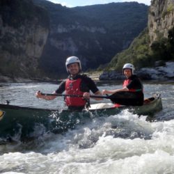 Paddling Ardeche rapids in open canoes