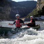 Paddling Ardeche rapids in open canoes